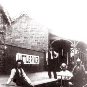 This locally famous photo was taken in 1909. The fellow on the tricycle with white top is Archie Boadle and the guy standing on the platform with the white shirt is Tom McLean (snr). Oth